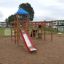 Outdoor Climbing Booth playground equipment with slide and climbing structures.