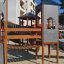 Playground structure Citadel castle with slide in urban area