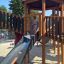 Citadel castle with slide playground equipment for children in a park.