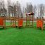Trixie playground equipment for children on artificial grass in a residential area