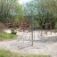 Small Powerclimber climbing net in a park playground setting.