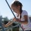 Child climbing on Small Powerclimber climbing net.