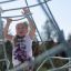 Child climbing on Small Powerclimber climbing net at playground.