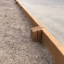 Larch Board Section Low bordering a playground area'