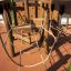 Spillikins wooden playhouse with rope bridges and wooden climbing structures.