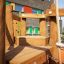 Spillikins wooden playhouse in an outdoor playground.