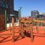 Wooden play structure with climbing and balancing elements in the Spillikins wooden playhouse.