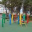 Colorful Crayons wooden playhouse outdoor playground.