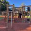 Wooden playhouse Climbing Booth Nature with climbing ropes and slides on playground.