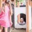 Children playing at the Theseus playground structure.