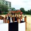 Children playing on the Ariadne playground with slides and climbing frames, surrounded by trees and 