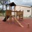 Triangle Modern Nature wooden playhouse with slide on outdoor playground