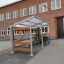 Bike Parking II outdoor bike shelter with metal frame and wooden details
