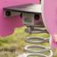 Close-up of Piggy rocking playground equipment showing spring mechanism.