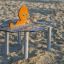 Octopus Play Table covered in sand at a playground.