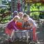 Children playing at Octopus Play Table on a playground
