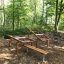 Outdoor fitness bench, Steel Construction, in a forest park setting.
