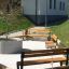 Ryga Bench w/ Backrest in a modern apartment courtyard'