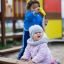 Children playing in a Sandbox.
