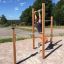 Man using Pull Bars outdoor exercise equipment.