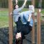 Children playing on Pull Bars in an outdoor playground.