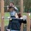 Women exercising on Pull Bars in an outdoor gym.