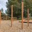 Wooden pull bars in an outdoor playground.