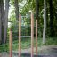 Pull Bars for outdoor exercise in a wooded park area.