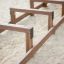 Wooden Balance play structure on sandy playground.