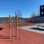 Outdoor fitness equipment Bars II on a rooftop playground with scenic mountain view in the backgroun