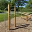 Outdoor fitness equipment for calisthenics Bars II in a park setting.