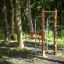 Outdoor fitness equipment Bars II in a forest setting.