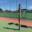 Outdoor playground equipment Handles standing on a sports field.