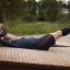 Man exercising on Sit-ups Bench in an outdoor park.
