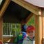 Children playing in a Sand Pavilion single playhouse.
