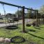 Swing set Nature Swing Frame 1(BNS) +2 with multiple swings in a playground.