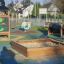 Playground featuring a sandbox and Tower with Baby Dragon single playhouse.
