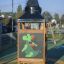 Playhouse tower with baby dragon design on a playground.