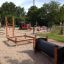 Wooden vertical ladder in a playground.