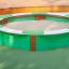 HPL Sandbox with green seats in a playground.