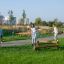 Children playing on a Balancer in a park.