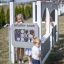 Children playing at the Gas Station playground structure by Lars Laj.