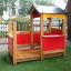 Wooden Veranda House single playhouse with red panels in a playground setting.