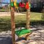 Outdoor Market Stand playground equipment with colorful fruit decorations.