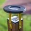 Outdoor magnifying glass on a wooden stand