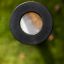 Children's outdoor magnifying glass on green grass background.