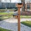 Wooden Bird Feeder in a Garden
