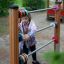 A child playing with the Abacus outdoor playground equipment.