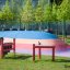 Outdoor Xylophone playground musical instrument on a colorful rubber surface.