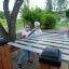 Children playing on outdoor xylophone in a park.